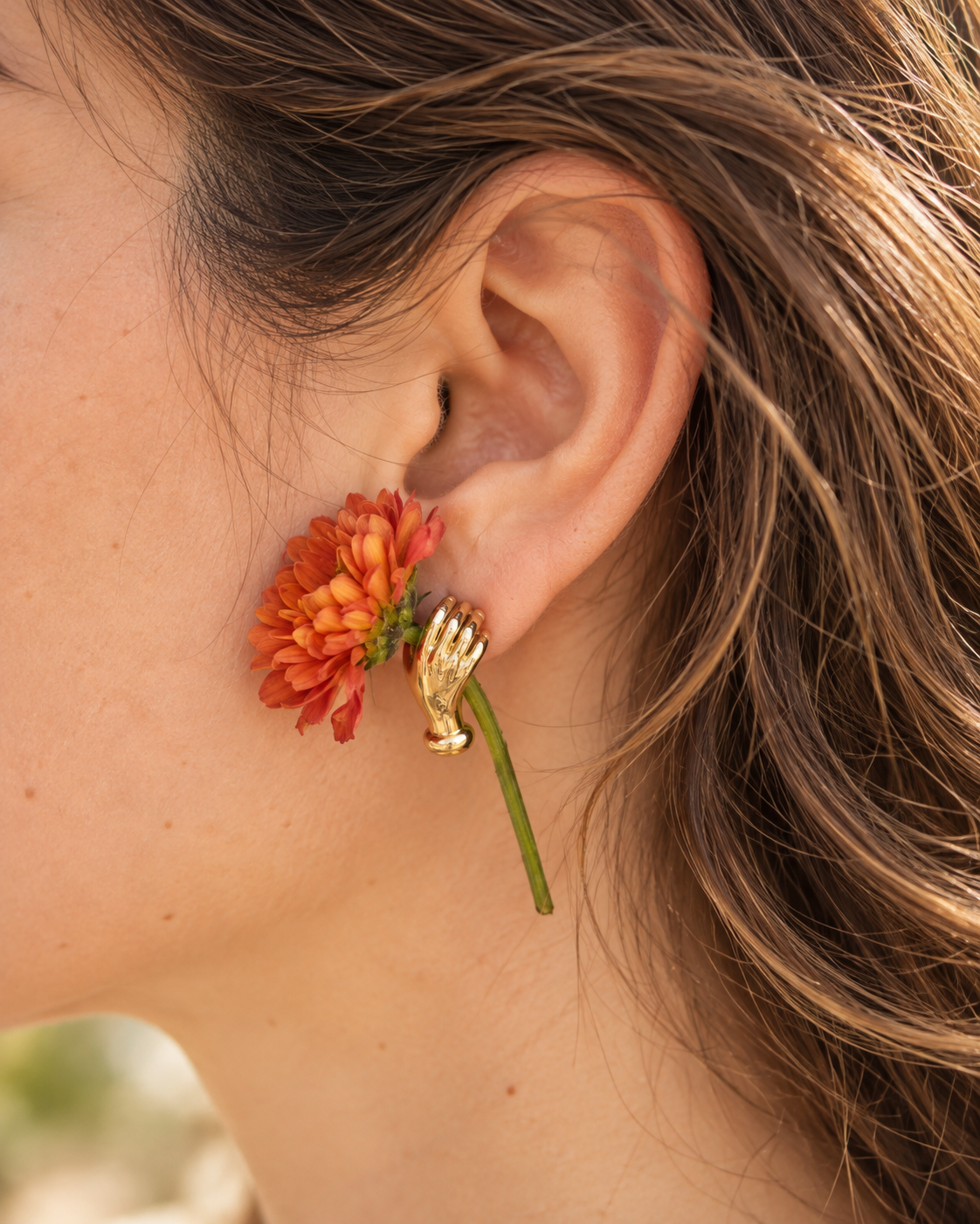 Hand Holding Flower Earrings