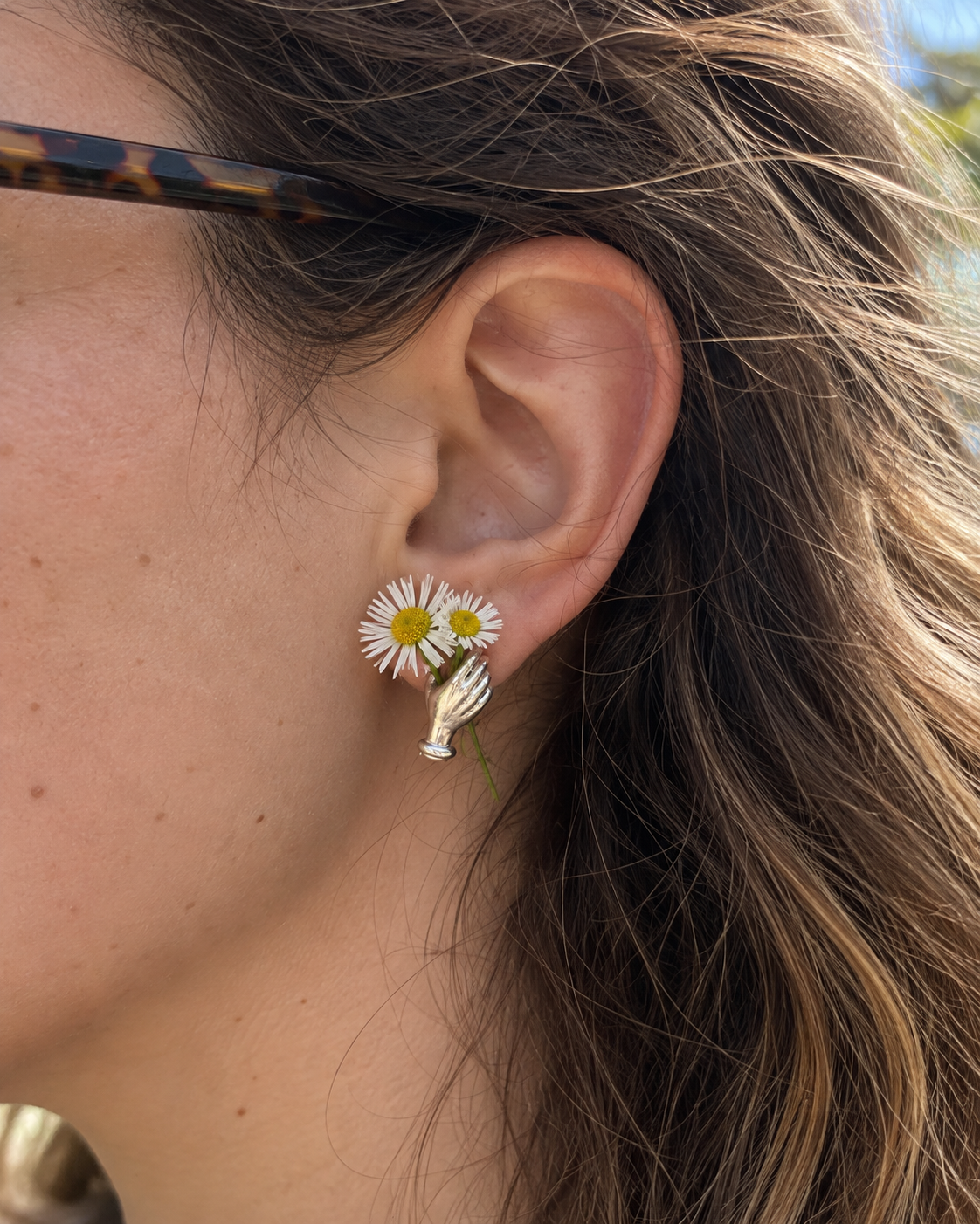 Hand Holding Flower Earrings